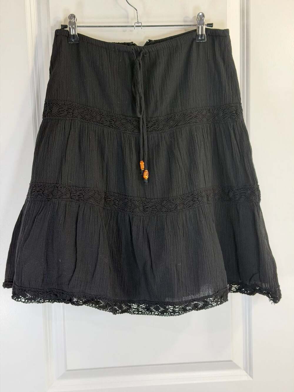 Lucy Love Black Tiered Boho Mini Skirt with Crochet Lace Trim and Beaded Tassels